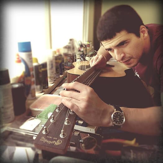 Asaf Atias working on a musical instrument